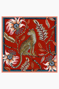 Illustration of a leopard sitting among large, stylized flowers and leaves in a jungle-inspired pattern with a blue border, from Ardmore Design.