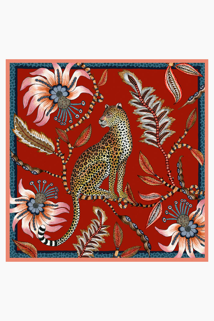 Illustration of a leopard sitting among large, stylized flowers and leaves in a jungle-inspired pattern with a blue border, from Ardmore Design.