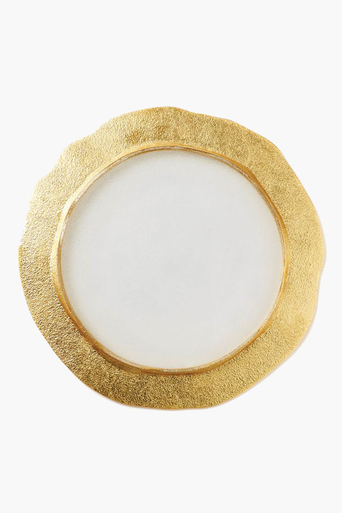 A round white Vietri plate with an irregular, textured gold rim, reminiscent of a handmade Italian or gold charger plate.