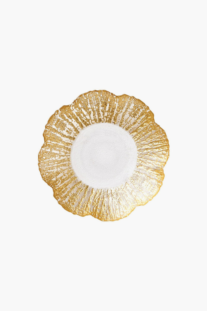 A round Vietri plate with a scalloped edge, textured gold rim, and smooth white center, evoking the style of an Italian artisan platter.