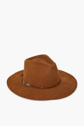 The Freya handmade cowgirl hat is crafted from brown felt with a wide brim, a creased crown, and a decorative band accented by a feather.