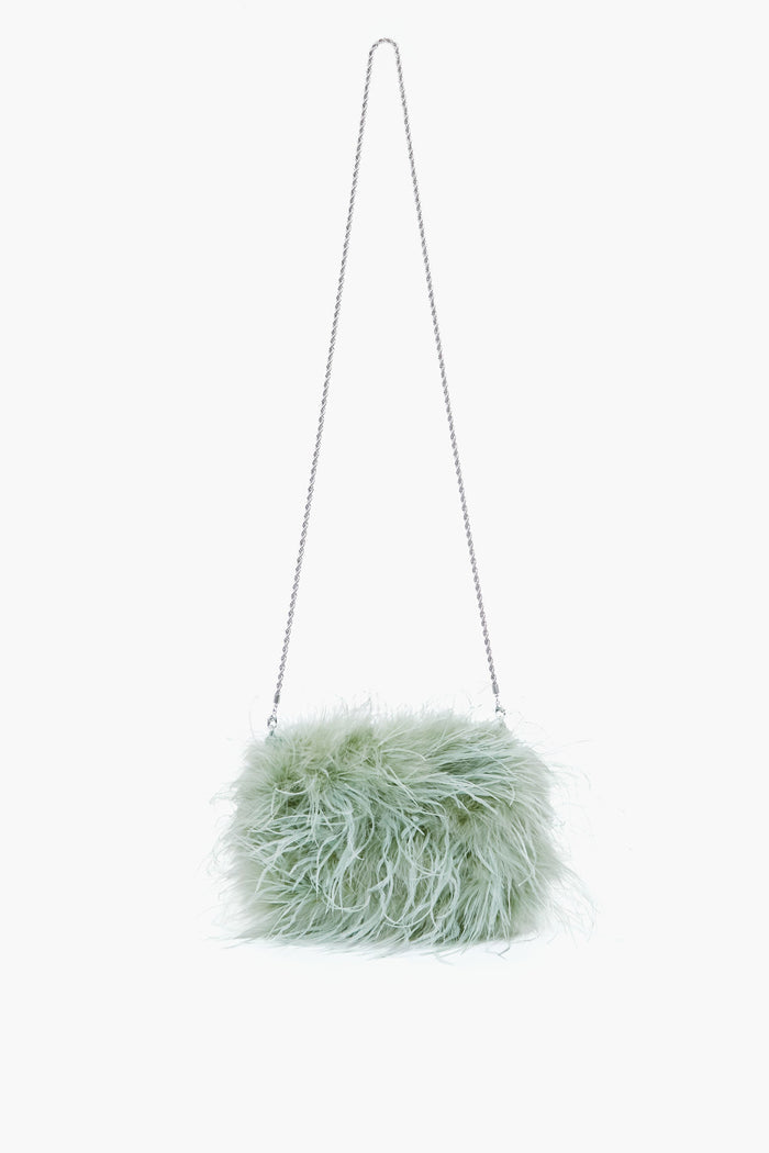 The Loeffler Randall light green fluffy feather clutch features a long silver chain strap, making it a chic crossbody pouch.