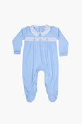 Nella Pima light blue long-sleeve footie pajamas, crafted from soft Peruvian Pima cotton with a white collar, footed legs, and chest stitching—ideal as a baby gift.