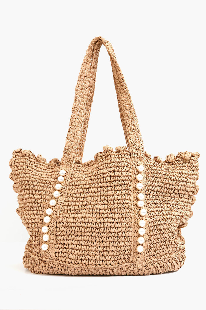 The BTB tote bag showcases a boho-chic style with scalloped edges, two handles, and two vertical rows of decorative white beads on the front.