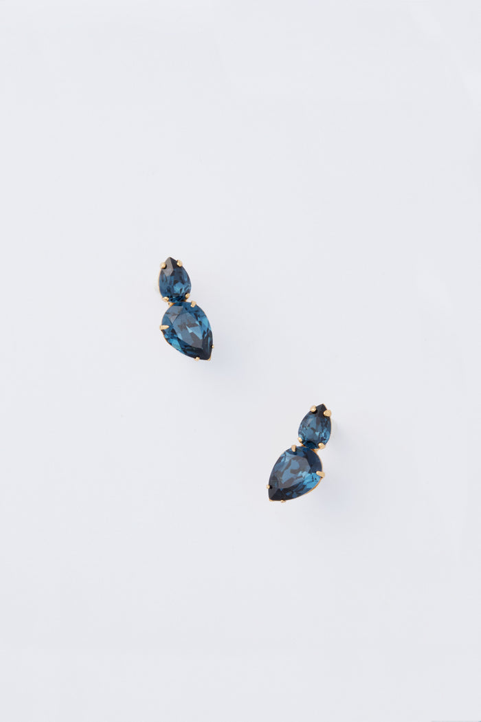 Jennifer Behr Sapphire Nadine Earrings: Handmade in New York, these gold stud earrings feature two blue faceted gemstones each—luxurious accessories for any occasion.