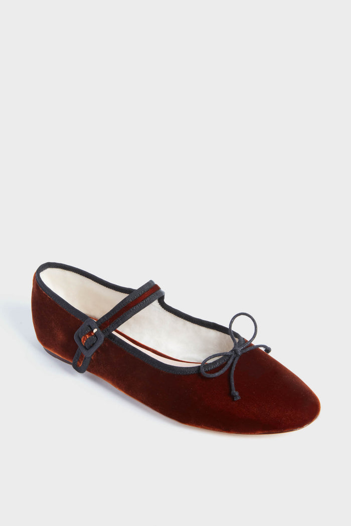 A single burgundy Sienna Velvet Chiara Mary Jane flat from Loeffler Randall, featuring a black buckle strap and a small front bow.