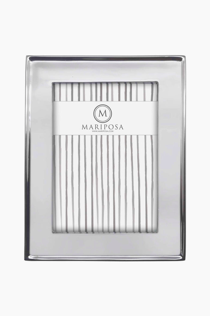 The Mariposa rectangular photo frame is handcrafted from recycled aluminum, features a smooth silver border, and displays a Mariposa insert with vertical gray lines—an eco-friendly addition to your home decor.