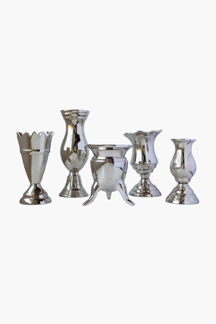 Five assorted silver-colored handcrafted aluminum vases by Chefanie are displayed in a row, perfect as Silver Bud Vases for elegant table decor.