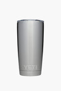 A YETI stainless steel tumbler with double-wall vacuum insulation and a transparent lid, shown standing upright.