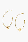 ASHA gold flower earrings feature a small flower-shaped charm and ball tip on each open end, perfect for adding a charming touch to any outfit.