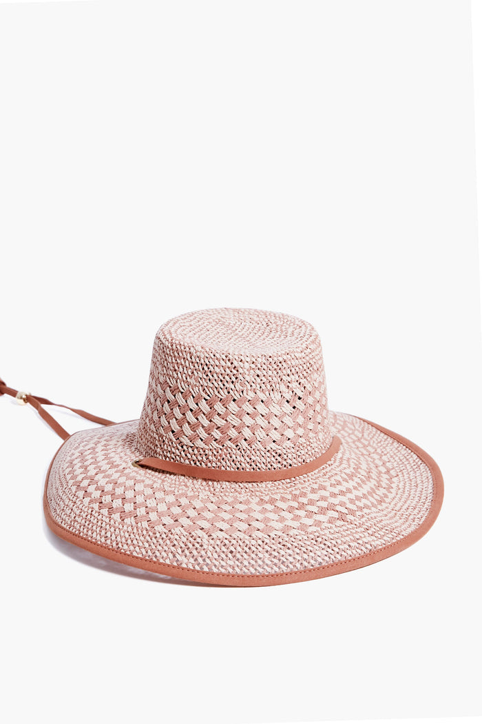 Lele Sadoughi pink checkered wide-brim straw hat with a flat crown and thin adjustable chin strap, styled as a flat top beach cap.