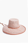 Lele Sadoughi pink checkered wide-brim straw hat with a flat crown and thin adjustable chin strap, styled as a flat top beach cap.