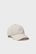 A light beige baseball cap by Harding-Lane with visible stitching and an embroidered Tuckernuck logo on the front, showcasing classic style inspired by needlepoint hats.