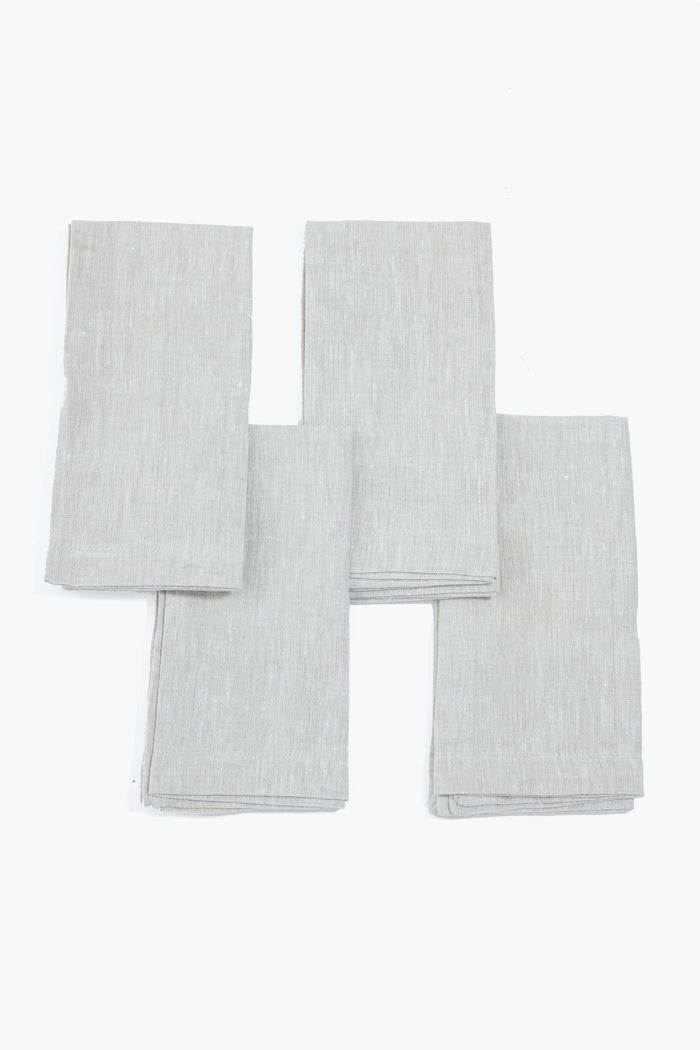 Stone Washed Linen Napkins set of four, neatly folded, showcasing classic, effortless elegance for fun, high-end dining experiences, perfect for any meal occasion.
