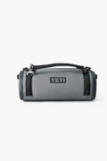 A durable gray YETI waterproof duffel with black straps and a top handle, ideal for outdoor adventures as a reliable gear bag.