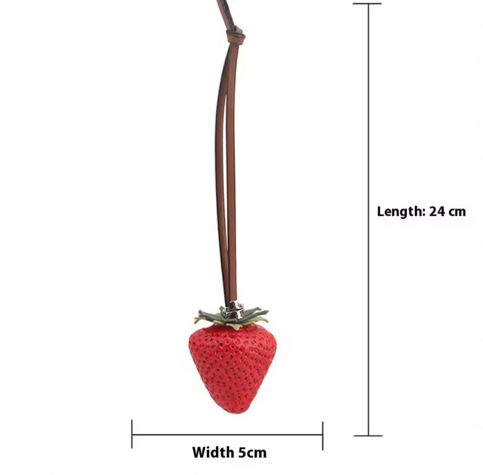 Red Strawberry Bag Charm size guide showing 24cm total length and 5cm width, with leather strap