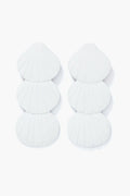 Sunshine Tienda’s white seashell earrings feature stacked shell shapes and lightweight, hand-painted design.