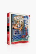 A 500-piece New York Puzzle Company jigsaw puzzle featuring Peter de Seve’s New Yorker cover illustration of people and a dog on a porch during a summer getaway.