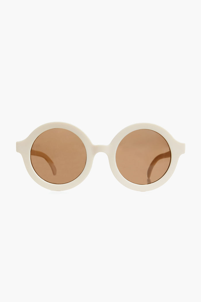 Babiators oval-shaped kids sunglasses feature white flexible frames, brown tinted lenses, and provide full UV protection.