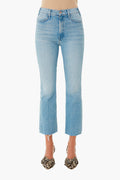 A person wears MOTHER light wash high-waisted cropped ankle jeans with a raw hem and animal print pointed-toe flats.