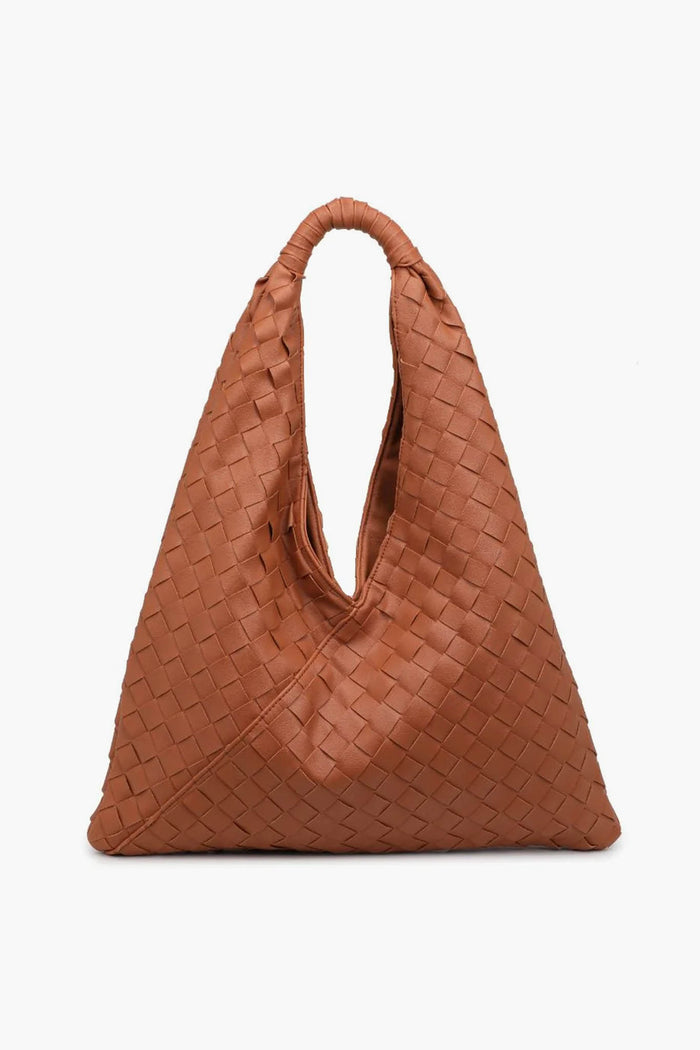 The Moda Luxe brown woven leather handbag features a triangular shape and single handle, making it a stylish choice as a trendy shoulder bag or woven tote.