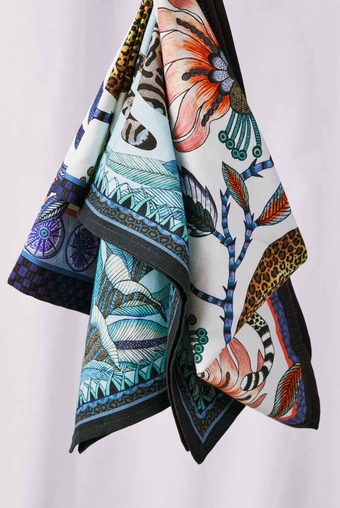 Tanzanite Cheetah Kings Tea Towel featuring classic, high-end botanical and cheetah motifs, effortlessly combining fun and elegance. Perfect for adding a unique twist to home decor.
