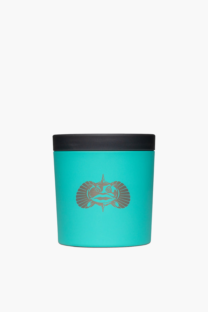 A turquoise Toadfish non-tipping cup holder with a black lid and a stylized animal face on the front, featuring Smartgrip technology.