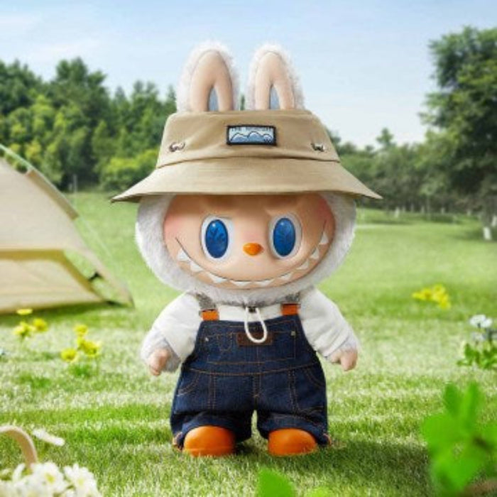 The Monsters Fall in Wild plush doll — close-up of white fur, blue eyes and pointed teeth