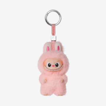 Pink fluffy keychain with a small face on a white background