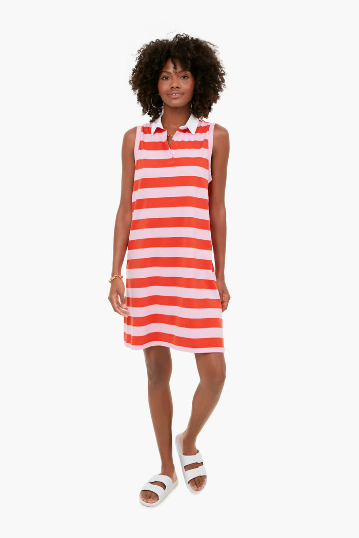A woman wears a KULE sleeveless red and white striped polo dress with a white collar, paired with white sandals and a gold bracelet.