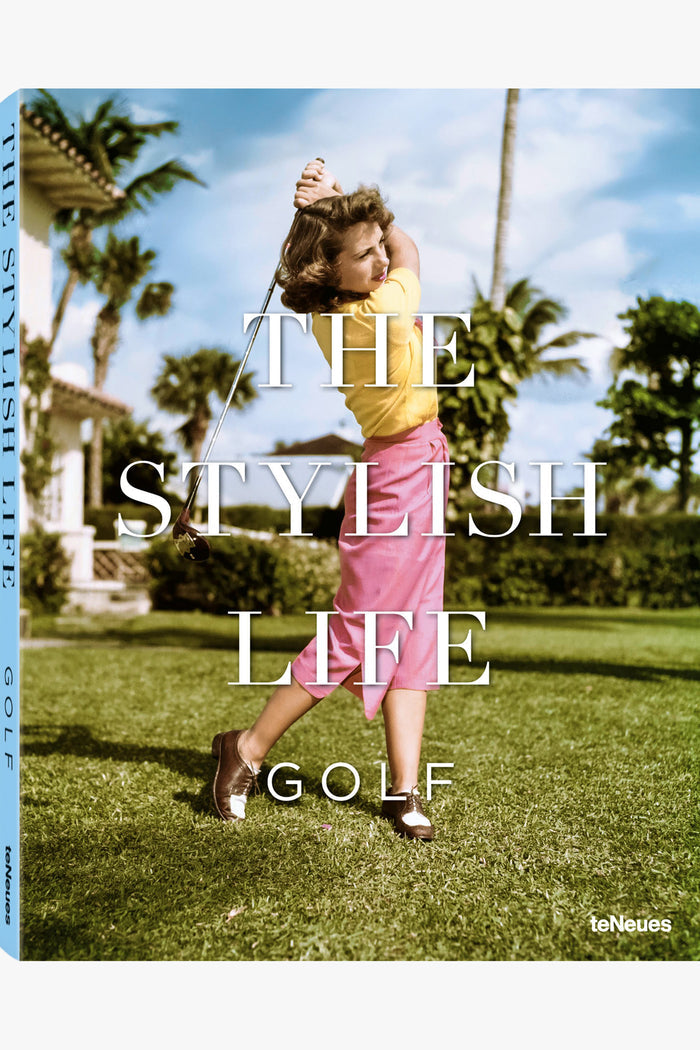 A woman swings a golf club on a grassy course, dressed in yellow and pink. The image displays “The Stylish Life Golf” from Teneues, making it a perfect gift for golf enthusiasts.