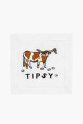 August Morgan’s white embroidered linen napkin features a brown and white longhorn cow, five tiny cups, and the word “TIPSY” underneath—a cheeky cocktail napkin perfect for lively gatherings.