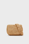 The Hat Attack small tan woven straw belt bag features a flap closure, matching strap with large buckle, and can be worn crossbody.