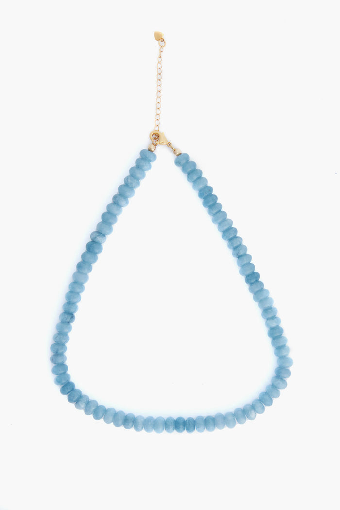 A contemporary Alexa Leigh Topaz Opal Necklace featuring round blue beads and a 14k gold-fill chain clasp in a teardrop design, perfect for modern jewelry lovers.
