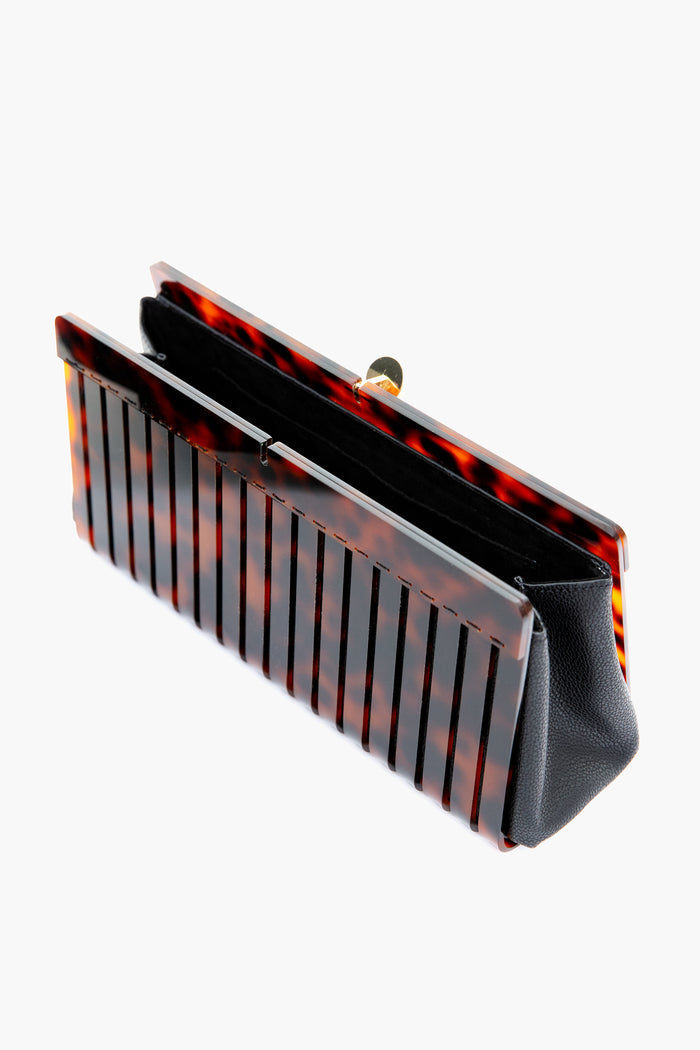 Tortoise Iris Clutch: A classic, high-end evening accessory with a faux tortoise acrylic shell, gold-tone clasp, and black leather trim for an effortless, fun style.