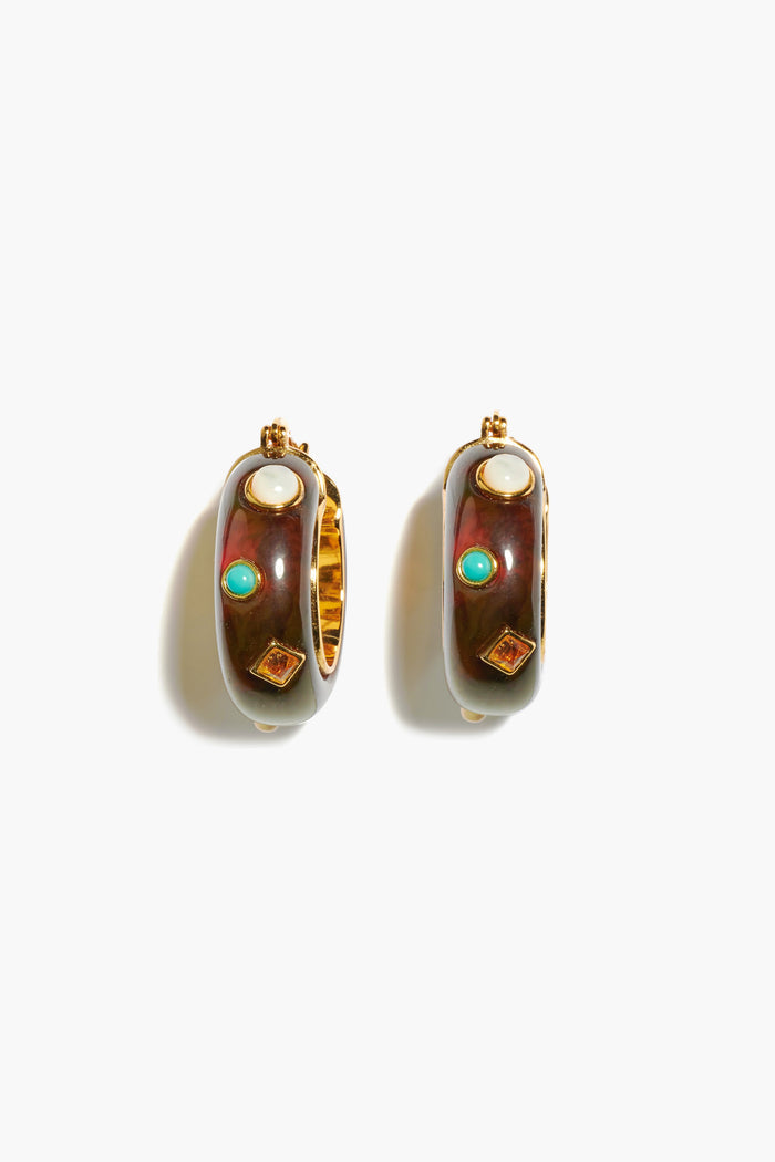 Lizzie Fortunato’s gold-plated brass Tortoise La Bomba Hoops feature brown enamel, each accented with a pearl, turquoise stone, and a small square gemstone.