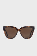 Le Specs oversized cat eye sunglasses in brown tortoiseshell with dark tinted lenses and UV protection.