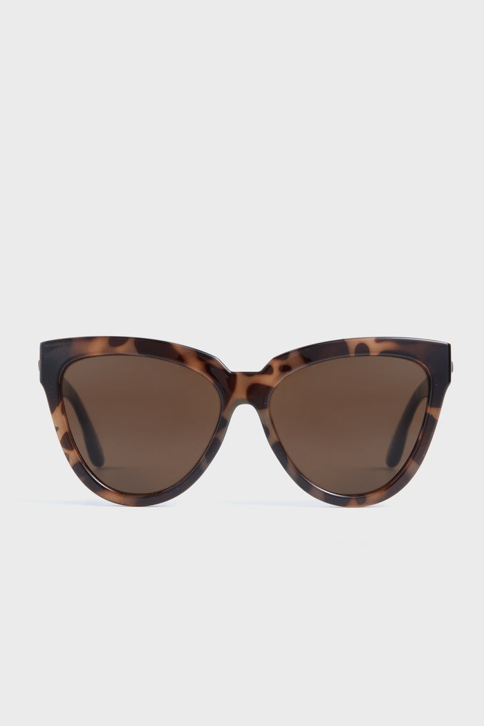 Le Specs oversized cat eye sunglasses in brown tortoiseshell with dark tinted lenses and UV protection.
