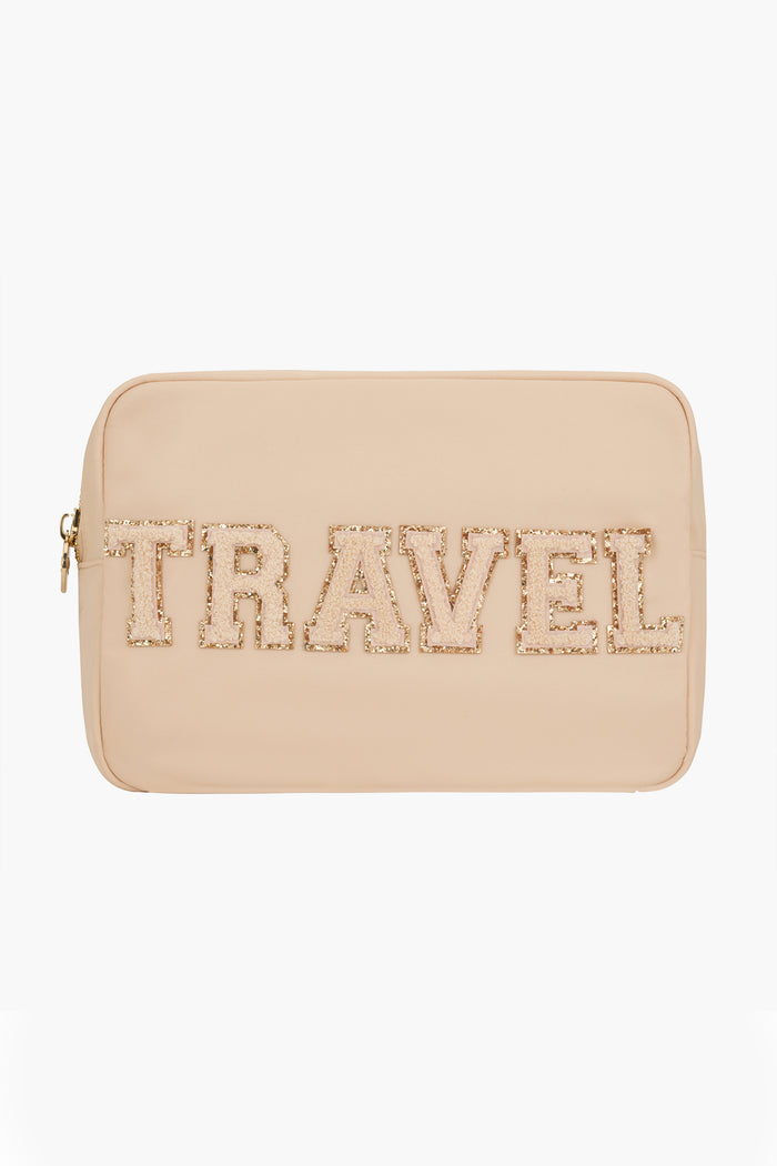 Stoney Clover Lane beige large pouch with zipper, featuring bold, textured "TRAVEL" letters—ideal for organizing your travel accessories.
