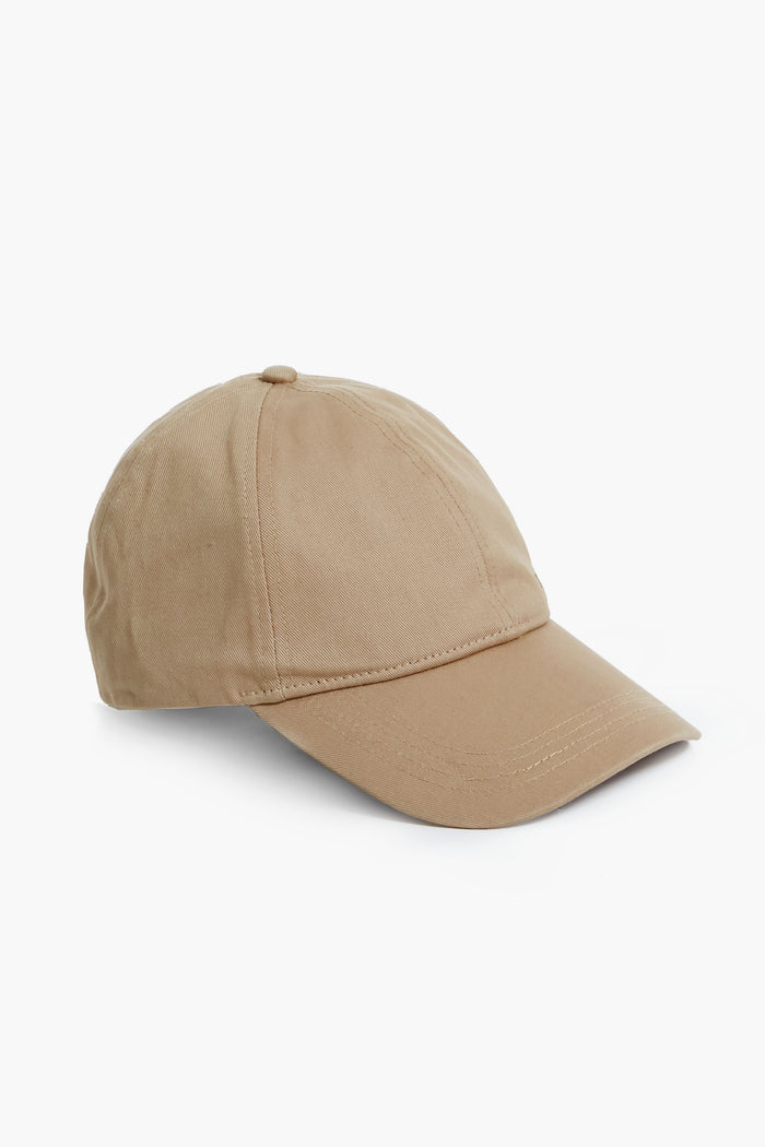 A plain beige cotton baseball hat by Barbour, featuring a curved brim and adjustable back strap.