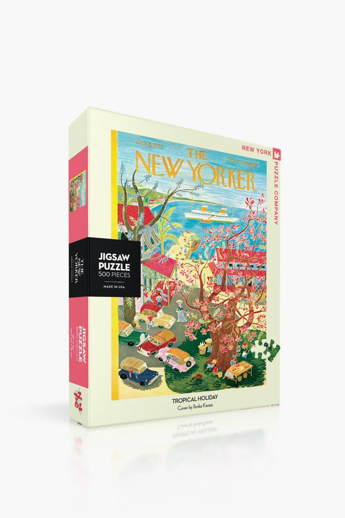A 500-piece jigsaw puzzle by New York Puzzle Company featuring Ilonka Karasz's "Tropical Holiday" New Yorker cover art with colorful cars, a cruise ship atmosphere, and vibrant tropical beach scenery.