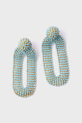 The Deepa Gurnani Turquoise Bianca Earrings are handcrafted dangle earrings with elongated ovals, adorned with blue and gold beads and inspired by Indian hand embroidery.