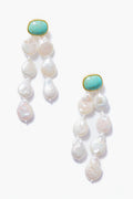 A pair of turquoise earrings by Lizzie Fortunato with gold settings and clusters of irregular freshwater pearls.