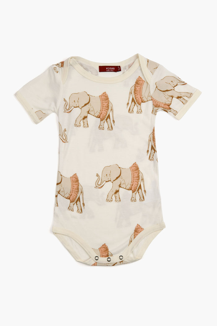 Milkbarn short-sleeved cream bamboo baby one piece with a repeating print of elephants in red blankets and snap closures. Soft, comfy everyday baby clothing.