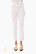 A person stands confidently in white AGOLDE mid-rise straight jeans and white sandals with gold accents.