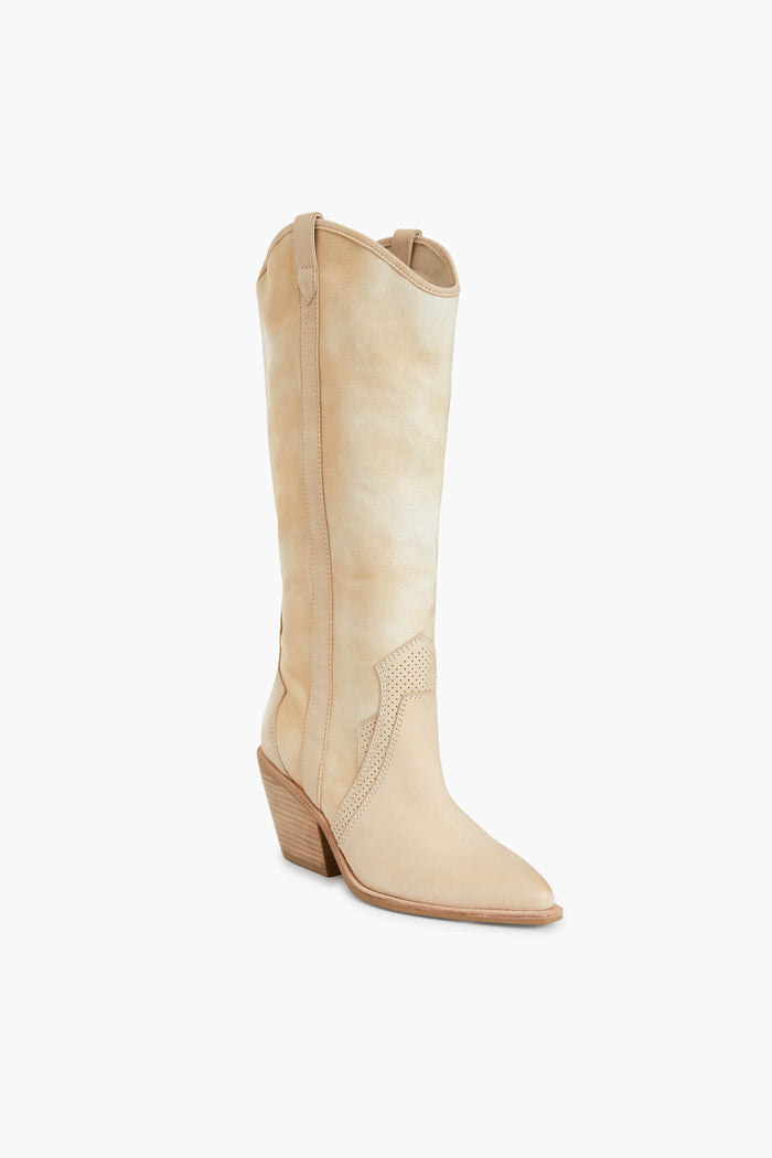 The Dolce Vita tall, light beige western boot features a pointed toe, angled stacked heel, pull tabs, and decorative side stitching—perfect for those seeking classic western style in a fashionable block heel boot.