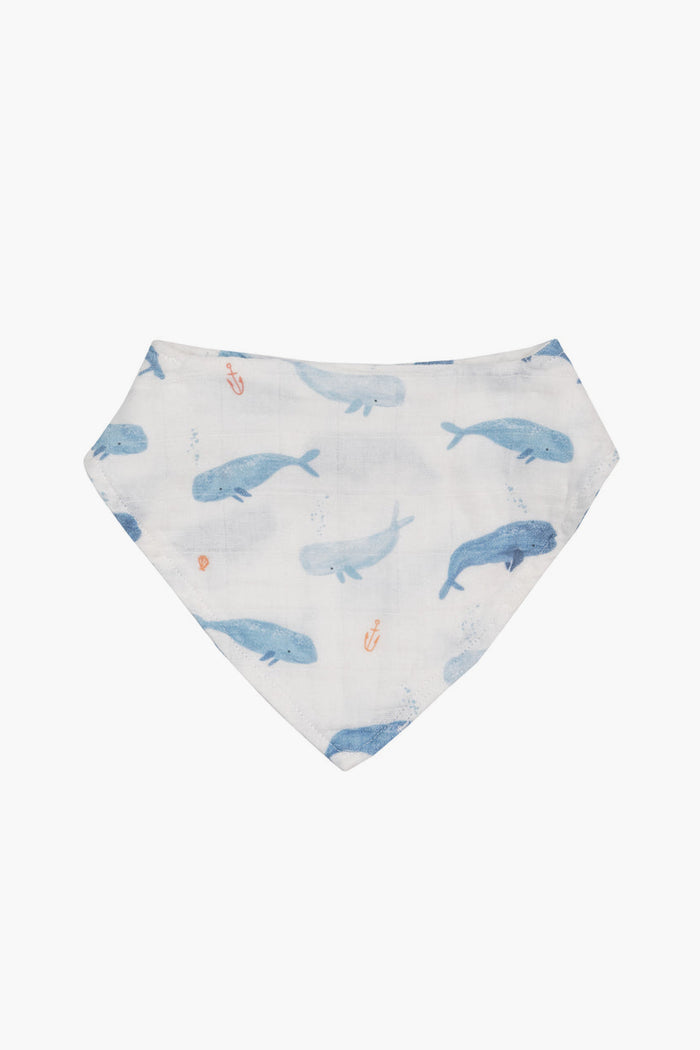 The Angel Dear white organic cotton muslin bandana bib features blue whales and small orange anchors—perfect for your little one.