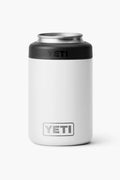 A white YETI can insulator with a black top, visible YETI logo on the front, and vacuum insulation to keep drinks cold.
