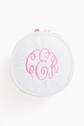 Caton's Wharf round white zippered button bag with a textured surface and pink monogram initials embroidered on top.