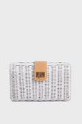 The Kayu rectangular white wicker clutch bag features a tan leather strap, gold clasp, and handcrafted basketweaving, creating a unique and sustainable accessory.